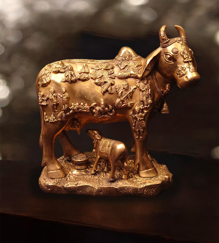 A handcrafted brass cow and calf figurine, a traditional Indian home decor piece available at Bharathiyam in Coimbatore.
