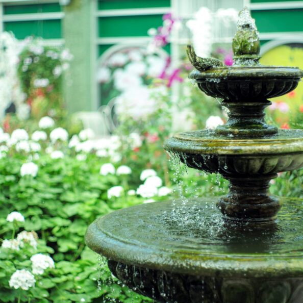 Selective focus on the water drop fall into the lower level of t