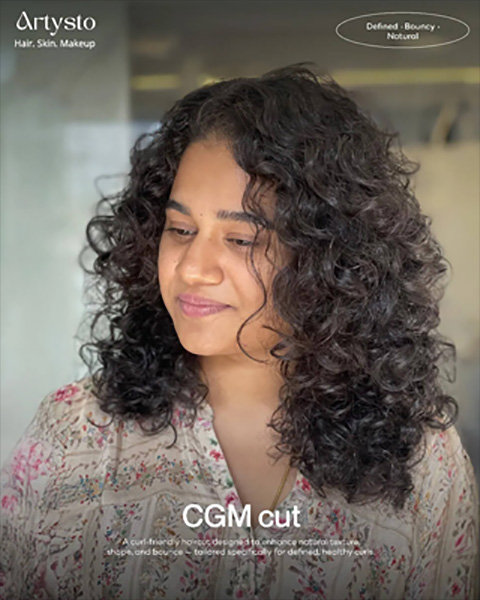 Happy woman showcasing a Curly Girl Method (CGM) haircut, highlighting defined curls and healthy volume at the best ladies parlour near me in Coimbatore.
