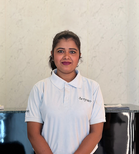 Professional makeup artist Ramya applying makeup to client